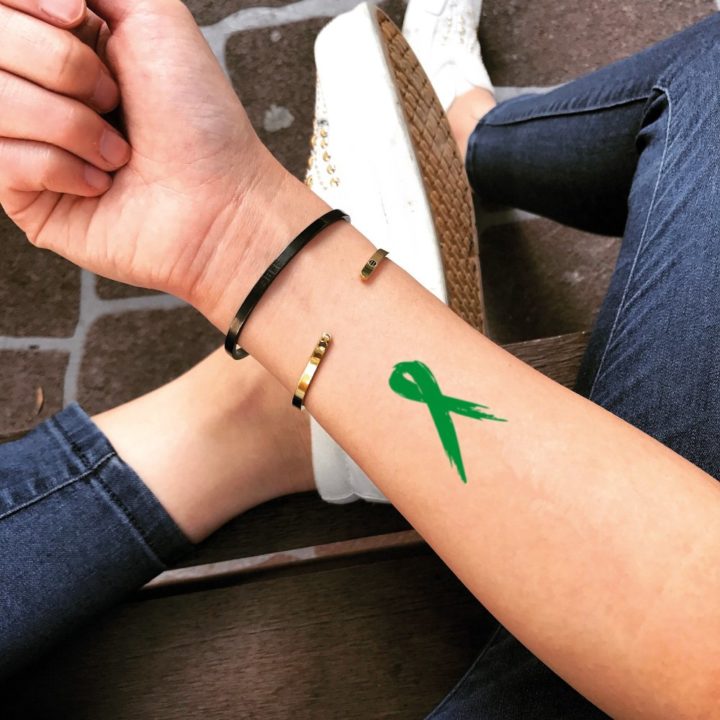 Anxiety ribbon tattoo: It is raising awareness of infant loss if you see someone with a ribbon tattoo on their body. Is one of the anxiety depression tattoos.