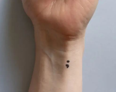 Semicolon depression tattoos represent resilience and hope in the face of mental health challenges.