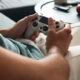 A person playing video games as a symbol of ADHD and gaming addiction.