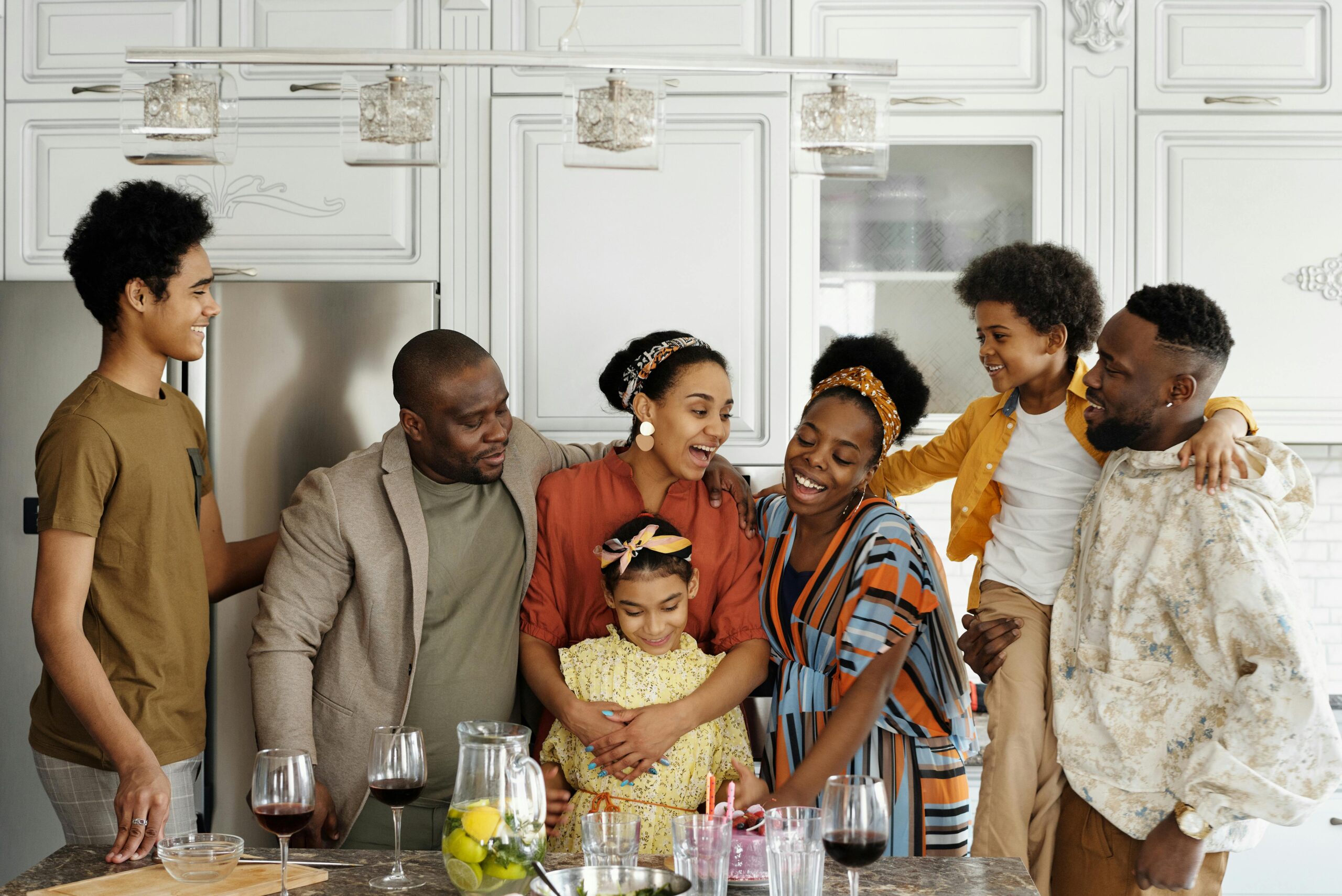 A happy family in the kitchen after talking about can a psychological trauma cause depression and anxiety