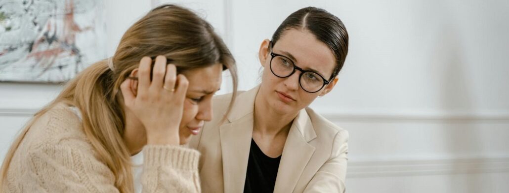 A woman counselling another woman about how to stop nocturnal panic attacks.