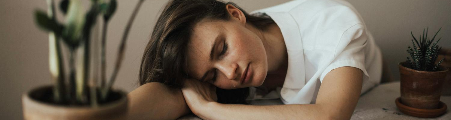 A woman looking tired and sad, ready for depression treatment center Florida